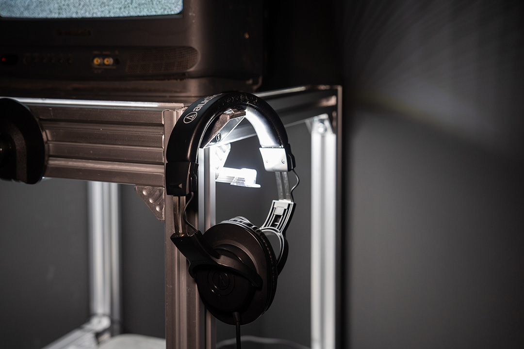headphones hanging of a television with static