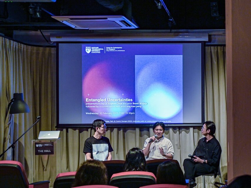 three men in a round table discussion